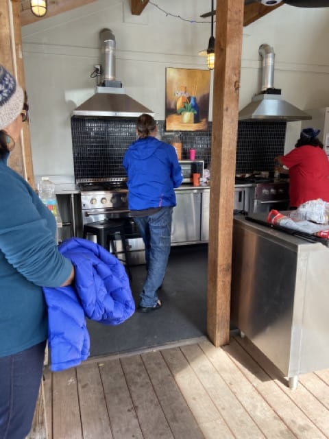 Making breakfast in the community kitchen