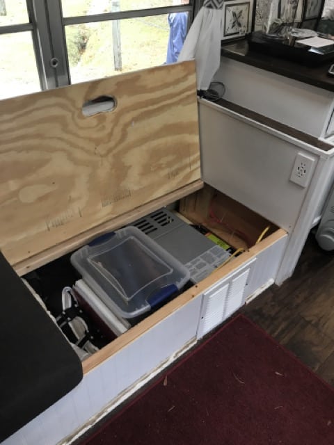 RISE OF THE TINY HOUSE MOVEMENT: EXPLORING THE ALLURE OF TINY HOMES 12 storage under the sofa