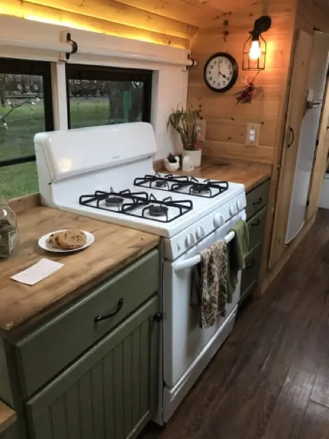 RISE OF THE TINY HOUSE MOVEMENT: EXPLORING THE ALLURE OF TINY HOMES 6 Skoolie kitchen