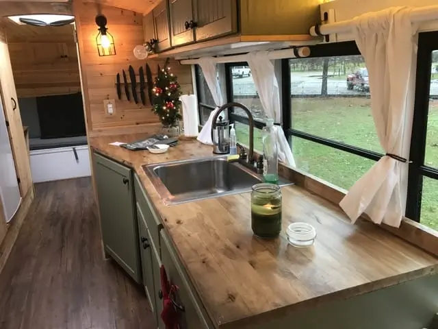 RISE OF THE TINY HOUSE MOVEMENT: EXPLORING THE ALLURE OF TINY HOMES 7 Skoolie kitchen