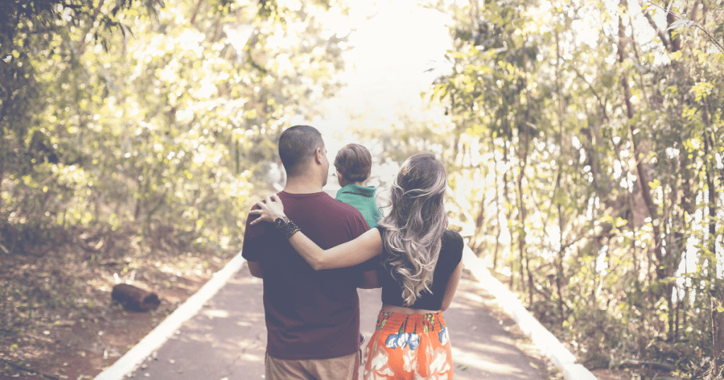 THE RISKY TRUTH: 17 DANGERS OF LIVING IN AN RV OR TINY HOUSE 8 a happy family of three strolling in nature