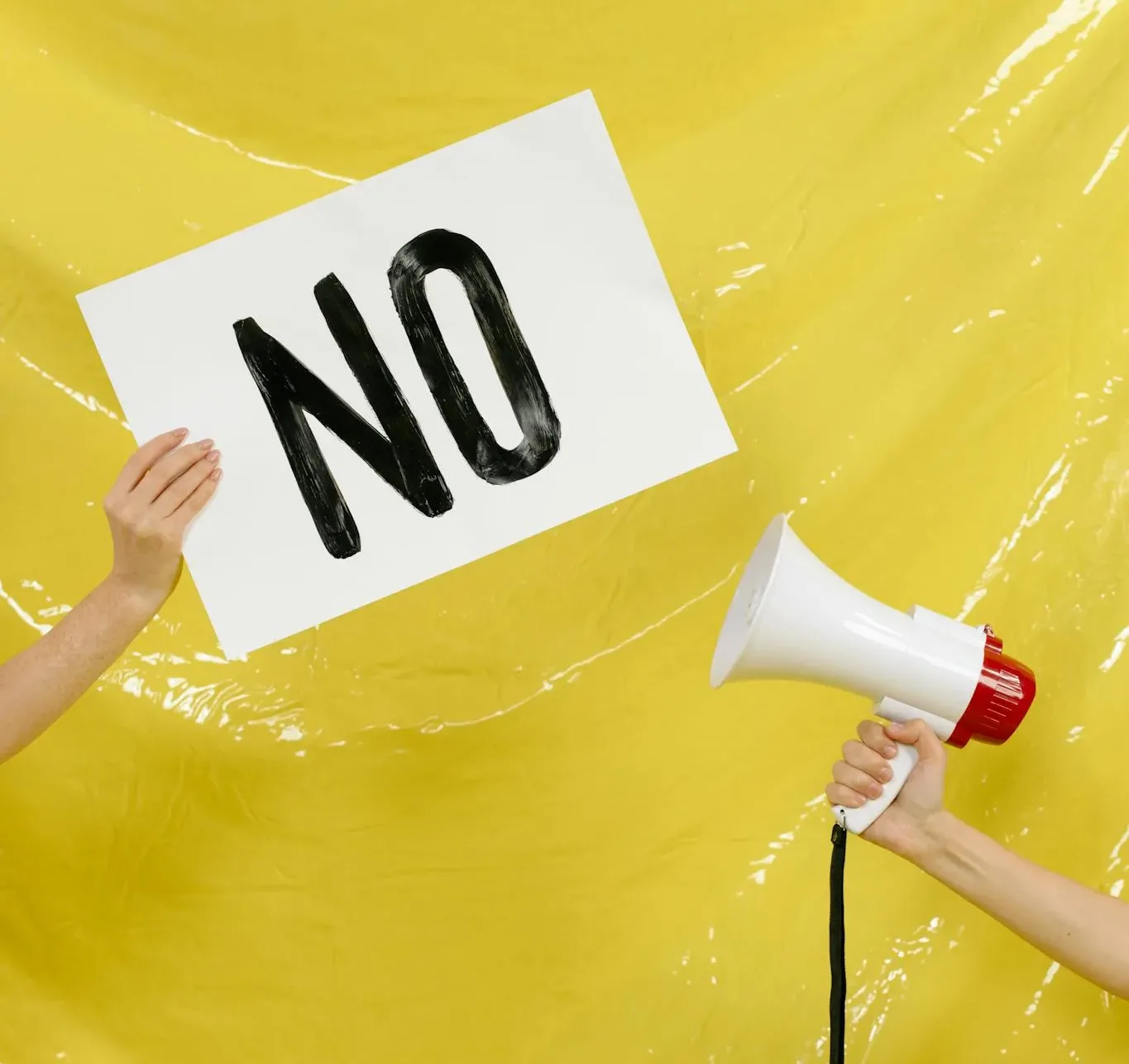 CHOOSING AN ADU CONTRACTOR OR BUILDER: WHAT YOU NEED TO KNOW 3 Hands Holding a Placard and a Megaphone