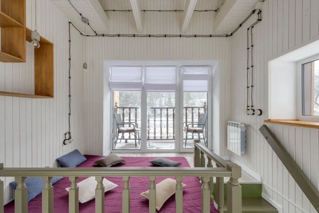 39 VALUABLE ADU IDEAS TO OPTIMIZE SPACE IN A BACKYARD BUILD (700+ PICS) 76 A Purple Bed on a Loft Adjacent to a Balcony