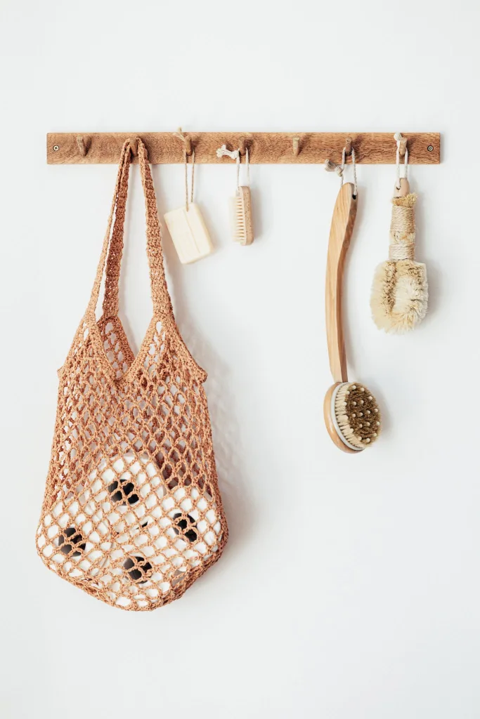 39 VALUABLE ADU IDEAS TO OPTIMIZE SPACE IN A BACKYARD BUILD (700+ PICS) 217 Body brushes and toiletries on wooden hanger