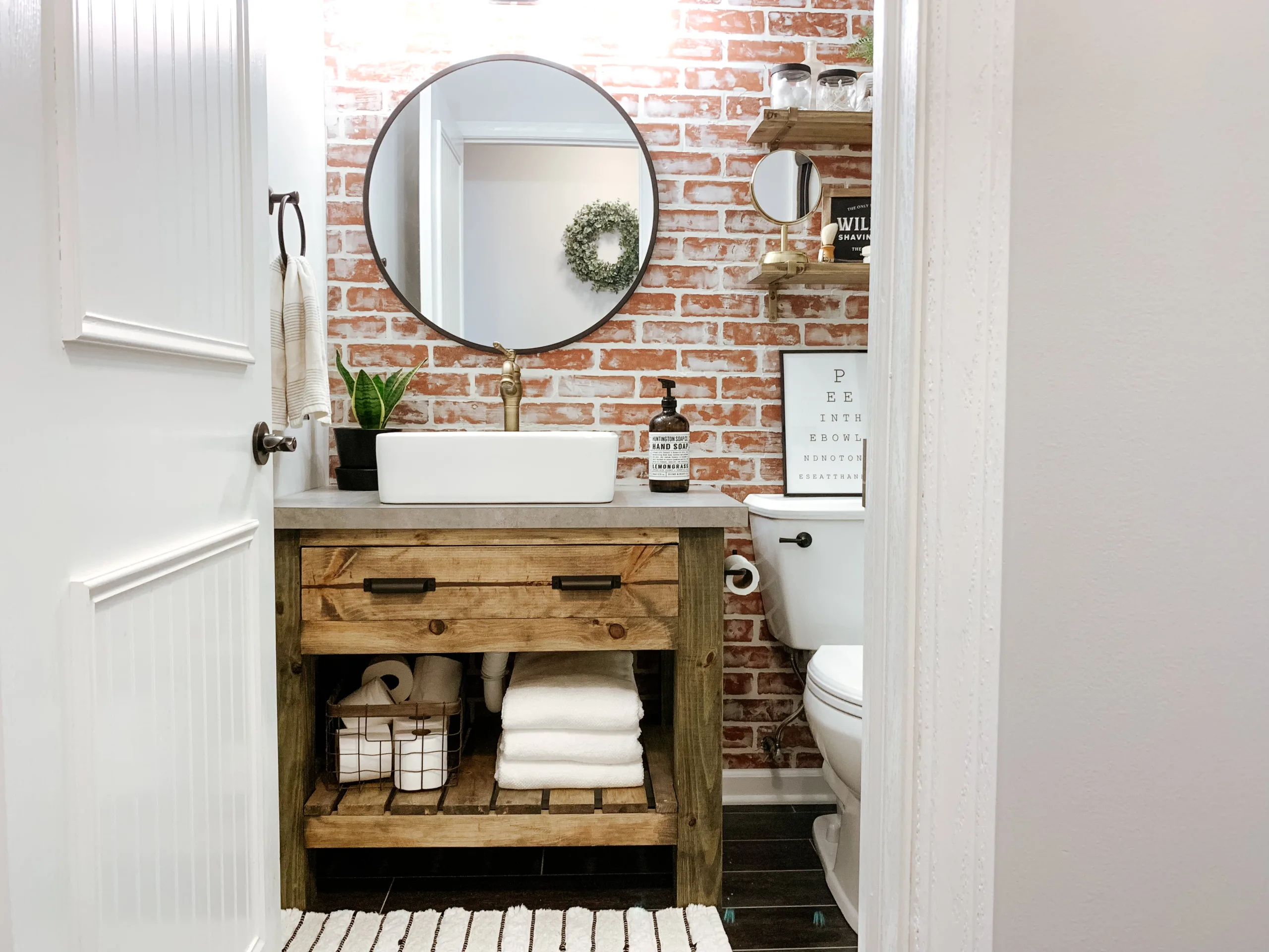 29 SMALL RUSTIC BATHROOM IDEAS ON A BUDGET YOU WILL LOVE 43 brick accent wall behind wood vanity sammyonstate