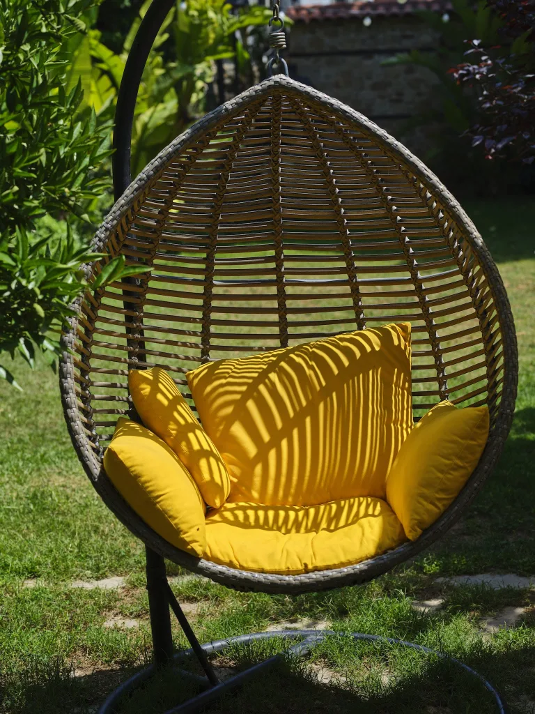 39 VALUABLE ADU IDEAS TO OPTIMIZE SPACE IN A BACKYARD BUILD (700+ PICS) 87 Close-up of a Hanging Egg Chair