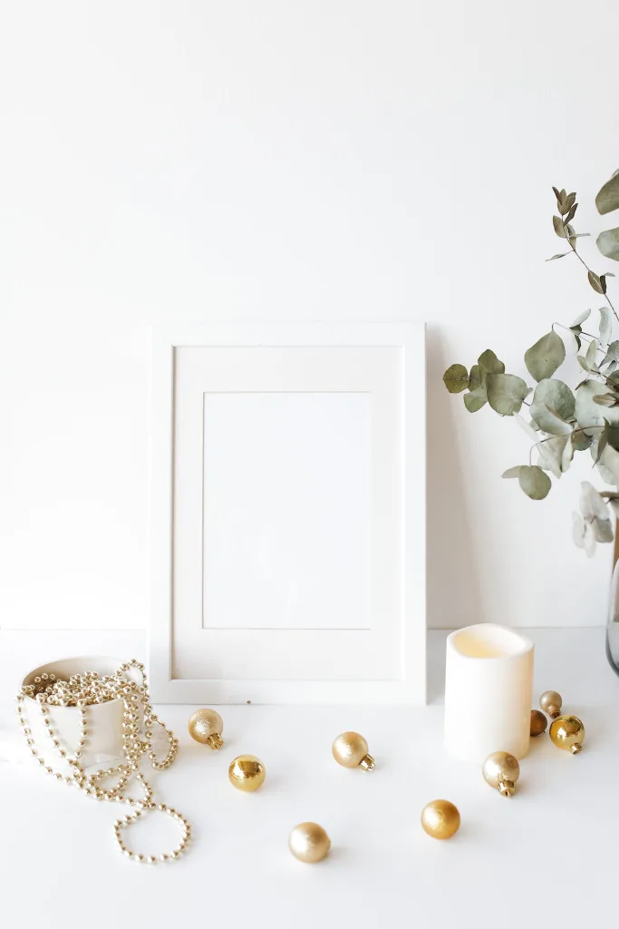 39 VALUABLE ADU IDEAS TO OPTIMIZE SPACE IN A BACKYARD BUILD (700+ PICS) 137 Composition of empty white photo frame placed on white table near decorative baubles candle and lush houseplant