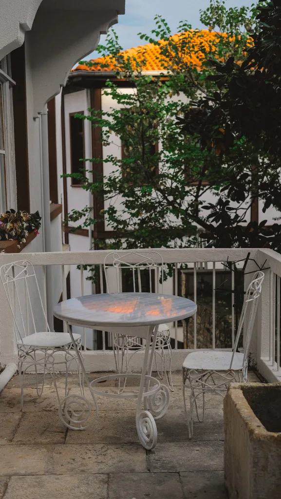 39 VALUABLE ADU IDEAS TO OPTIMIZE SPACE IN A BACKYARD BUILD (700+ PICS) 86 Iron Chair and Table on Balcony