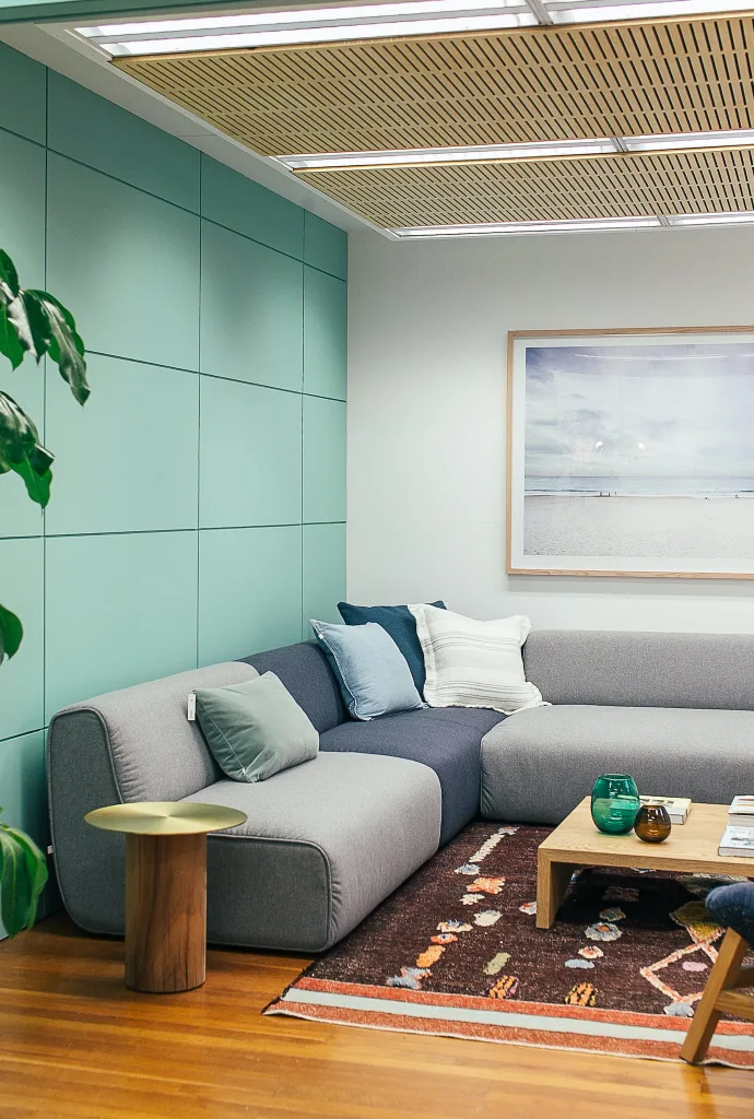 39 VALUABLE ADU IDEAS TO OPTIMIZE SPACE IN A BACKYARD BUILD (700+ PICS) 108 Light living room decorated with couch with pillows near table on carpet with painting on wall