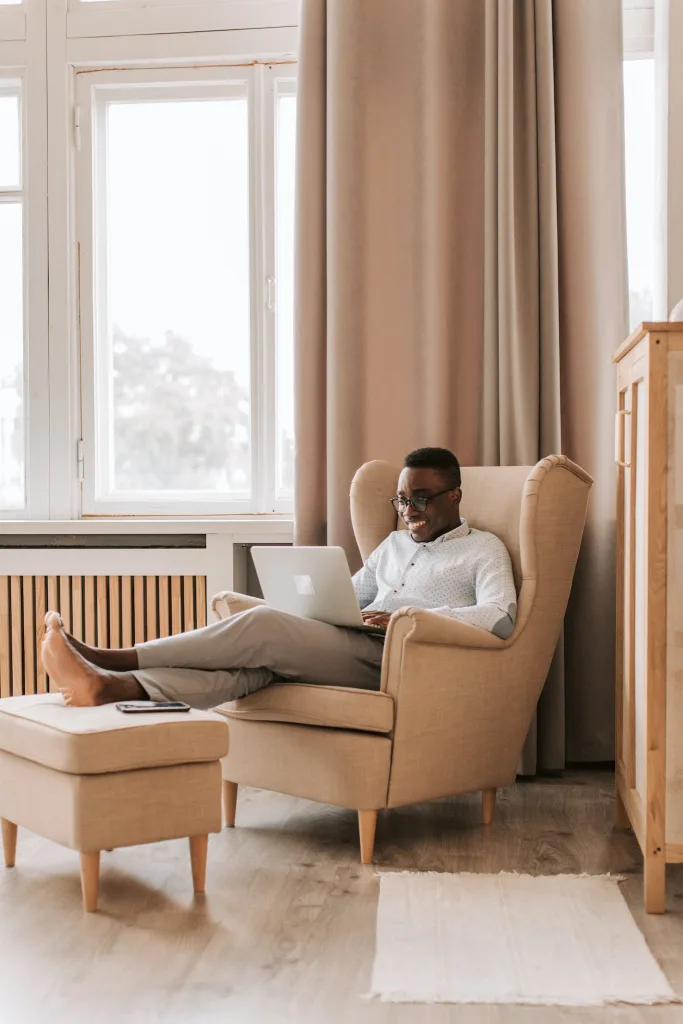 39 VALUABLE ADU IDEAS TO OPTIMIZE SPACE IN A BACKYARD BUILD (700+ PICS) 213 Man Relaxing and Working on his Laptop