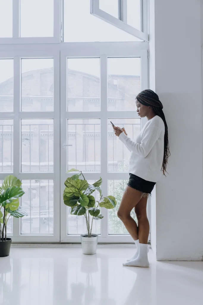 39 VALUABLE ADU IDEAS TO OPTIMIZE SPACE IN A BACKYARD BUILD (700+ PICS) 234 Woman in White Long Sleeve Shirt and Black Skirt Standing Beside Green Potted Plant