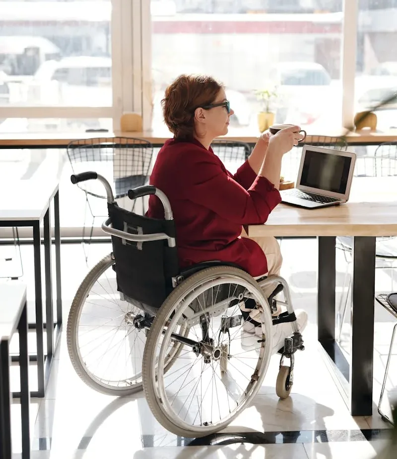 Woman in Red Blazer Sitting on Wheelchair