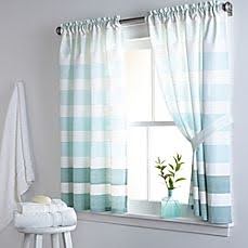 18 SMALL BATHROOM WINDOW IDEAS FOR NATURAL LIGHT AND PRIVACY 18 Light and airy bathroom view with seafoam green and white striped Curtains with Tiebacks drawn back to reveal a modest-sized window.