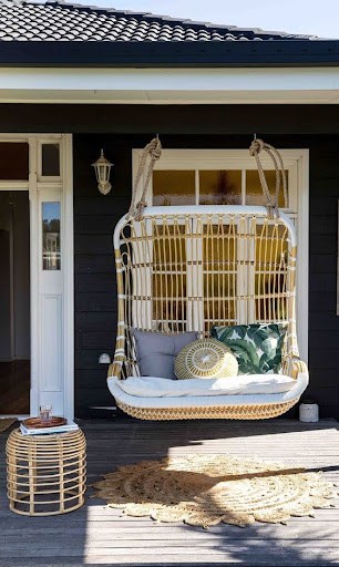 20 SMALL PATIO FURNITURE IDEAS TO MAKE A BIG IMPACT 7 Compact hanging garden chair providing a relaxing spot on a residential porch.
