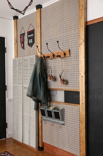 22 AWESOME SMALL WALK-IN CLOSET IDEAS FOR TINY HOMES & ADUS 7 A rustic-inspired entryway nook with a pegboard organizer flanked by wooden accents.