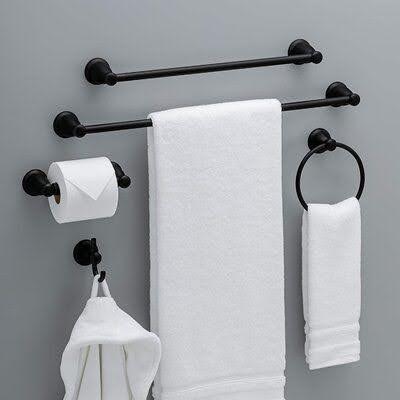 TOWEL STORAGE FOR A SMALL BATHROOM: 19 CREATIVE SOLUTIONS 5 White towels on a black rack and holder provide a sleek solution for a small bathroom.