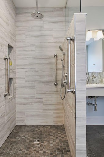 21 SMALL BATHROOM SHOWER IDEAS PERFECT FOR TINY HOUSES & ADUS 4 Modern tiny bathroom Open Shower with Half Wall with horizontal grey tile design, glass door, and wall-mounted shower fixtures.