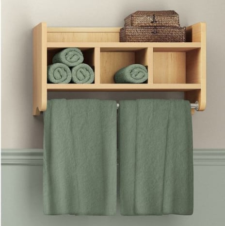 TOWEL STORAGE FOR A SMALL BATHROOM: 19 CREATIVE SOLUTIONS 17 A wooden bathroom shelf with hanging green towels and storage space above, a smart design for small spaces.