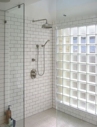 21 SMALL BATHROOM SHOWER IDEAS PERFECT FOR TINY HOUSES & ADUS 13 Compact but bright bathroom shower area with white subway tiles and glass block partition, creating an inviting, light-filled space.