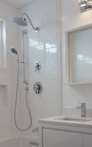 21 SMALL BATHROOM SHOWER IDEAS PERFECT FOR TINY HOUSES & ADUS 17 Sleek small bathroom shower space with modern fittings, a Dual Showerheads set against understated tiling for a minimalist, functional design.