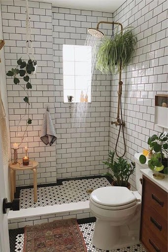 21 SMALL BATHROOM SHOWER IDEAS PERFECT FOR TINY HOUSES & ADUS 25 Quaint and inviting bathroom niche with a Shower Plant, ceiling-mounted rainfall showerhead, crisp subway tilework, and botanical adornments, creating a tranquil, spa-like retreat.