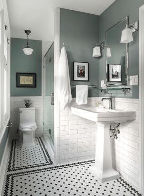 19 SMALL BATHROOM FLOOR TILE IDEAS: ADDING PERSONALITY TO A TINY HOUSE 5 A small bathroom featuring a traditional pedestal sink, white subway tiles with black Penny tiles, and soft sea-green walls for a classic look.