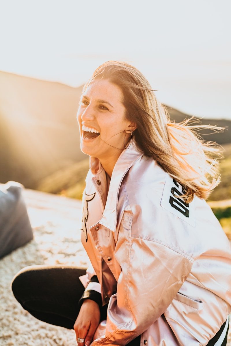 HOME 6 laughing woman while squatting