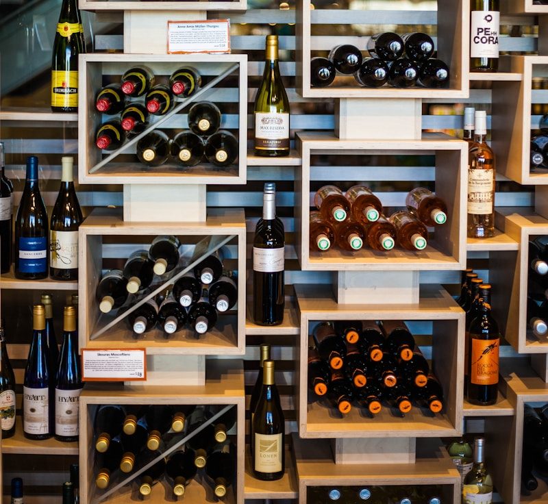 27 INSPIRING GARAGE CONVERSION IDEAS TO ADD LIVING SPACE TO YOUR HOME 26 wine bottles on brown wooden shelf